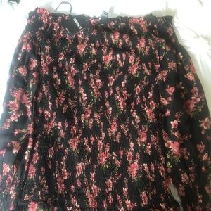 black floral dress with crisped sleeves and ending